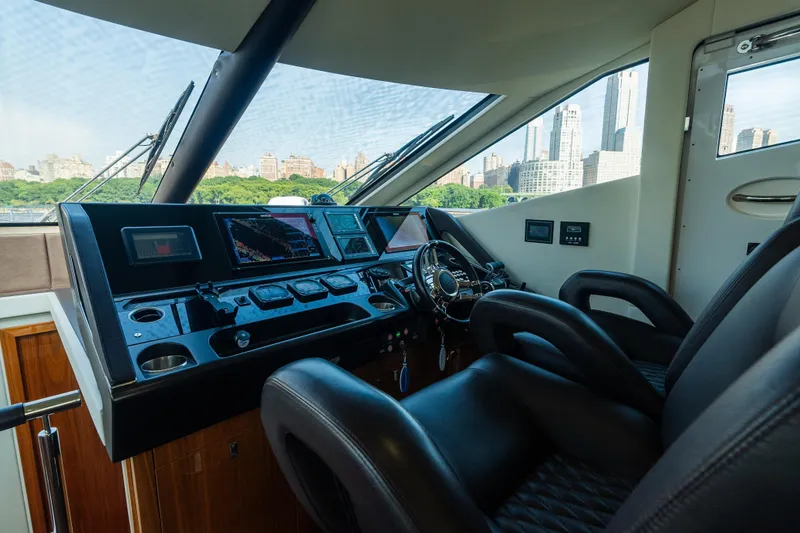 Slide: The Image of Interior helm of 2016 Sunseeker Manhattan 65 yacht with city skyline view. - 20