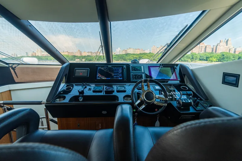Slide: The Image of Luxurious helm of 2016 Sunseeker Manhattan 65 yacht with cityscape view. - 21