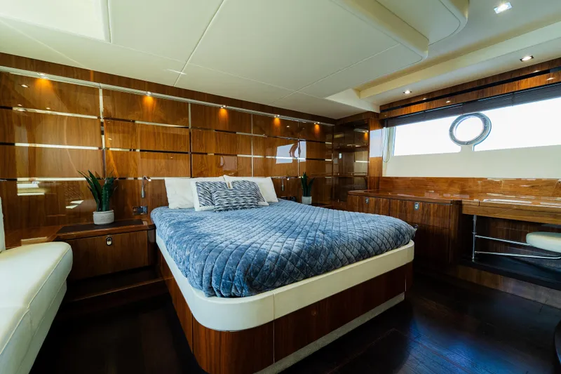 Slide: The Image of Luxurious bedroom interior of 2016 Sunseeker Manhattan 65 yacht with elegant wood paneling. - 25