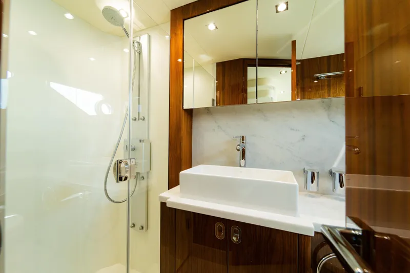 Slide: The Image of Luxurious bathroom in 2016 Sunseeker Manhattan 65 yacht with modern fixtures and elegant design. - 27