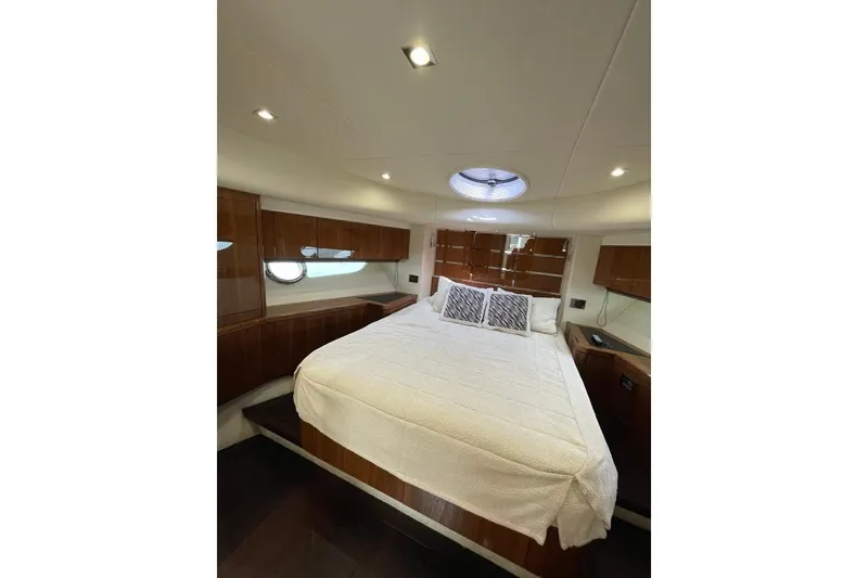 Slide: The Image of Luxurious bedroom interior of 2016 Sunseeker Manhattan 65 yacht with elegant wood finishes. - 28