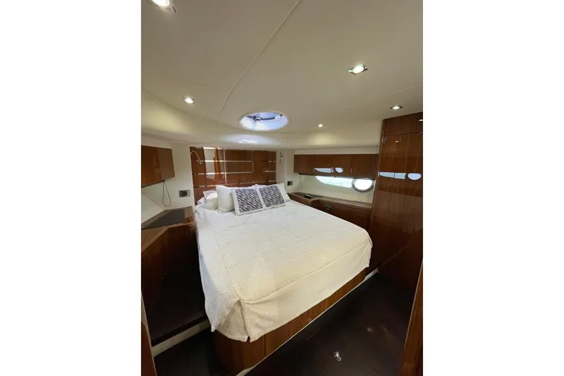 Slide: The Image of Luxurious bedroom interior of 2016 Sunseeker Manhattan 65 yacht with elegant wood finishes. - 29