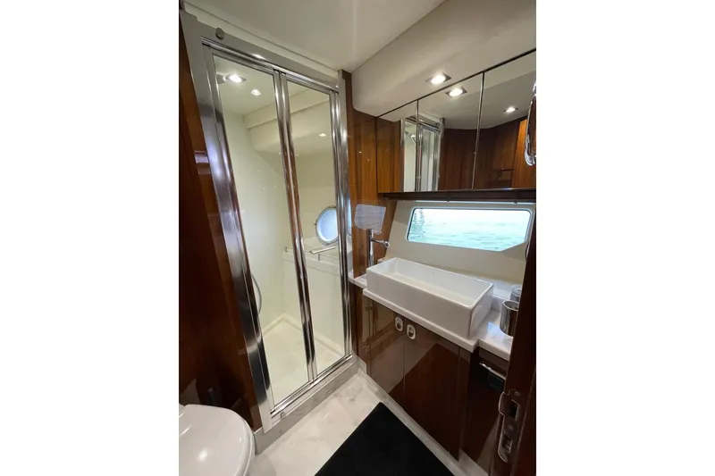 Slide: The Image of Luxurious bathroom in 2016 Sunseeker Manhattan 65 yacht with modern fixtures and ocean view. - 31
