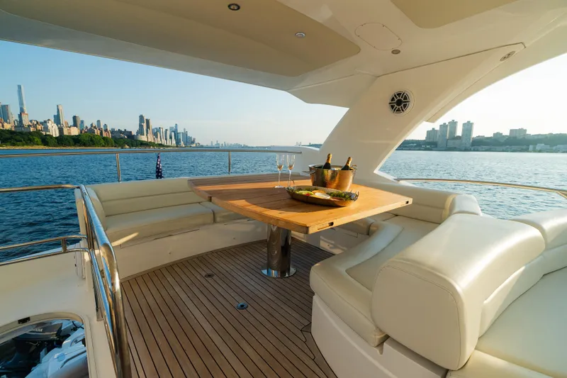 Slide: The Image of Luxurious 2016 Sunseeker Manhattan 65 yacht with elegant seating and city skyline view. - 39