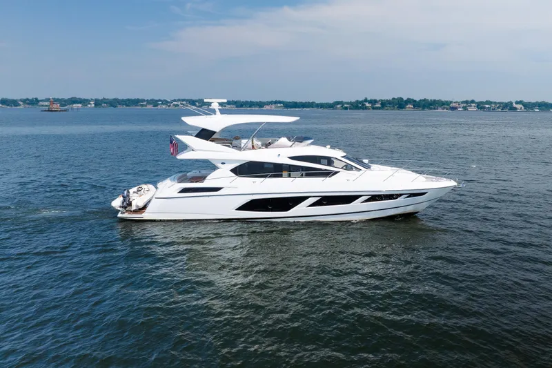 Slide: The Image of 2016 Sunseeker Manhattan 65 yacht cruising on open water. - 4