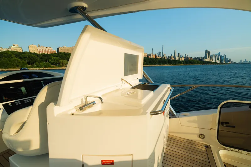 Slide: The Image of Luxurious 2016 Sunseeker Manhattan 65 yacht with city skyline and waterfront views. - 41