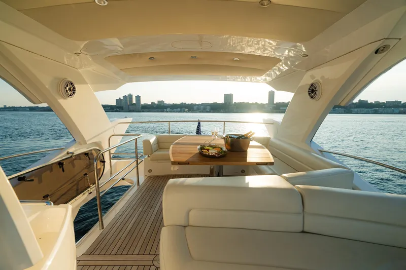 Slide: The Image of Luxurious 2016 Sunseeker Manhattan 65 yacht interior with elegant seating and ocean view. - 47