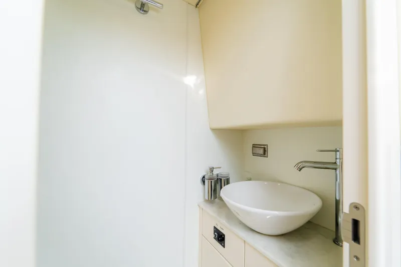 Slide: The Image of Modern bathroom sink in 2016 Sunseeker Manhattan 65 yacht, featuring sleek design and fixtures. - 52