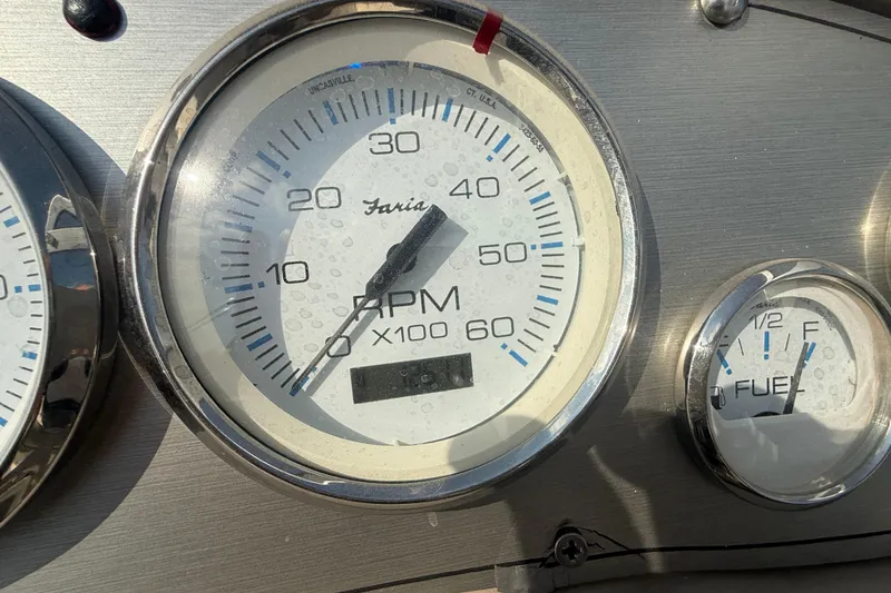 Slide: The Image of Close-up of 2007 Larson Cabrio 260 boat tachometer and fuel gauge. - 17
