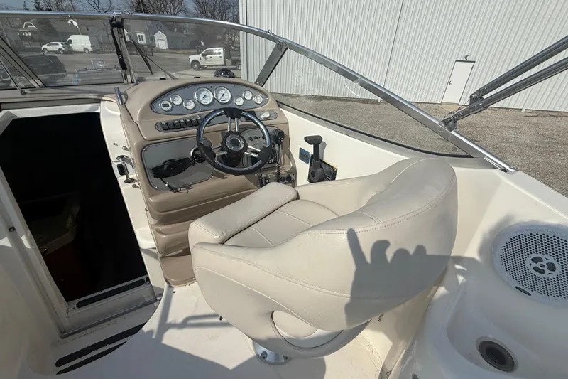 Slide: The Image of 2007 Larson Cabrio 260 boat cockpit with steering wheel and control panel. - 20