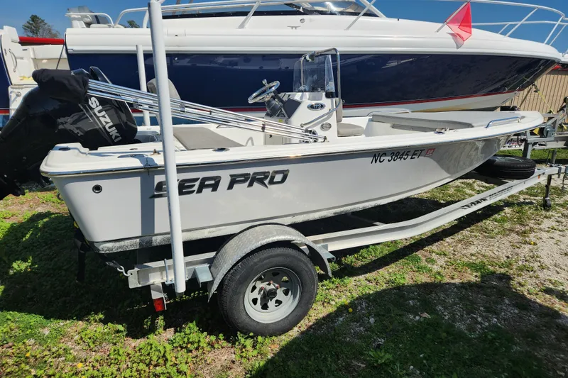 The Image of 2021 Sea Pro 172 Bay boat on trailer with Suzuki outboard motor. - 0