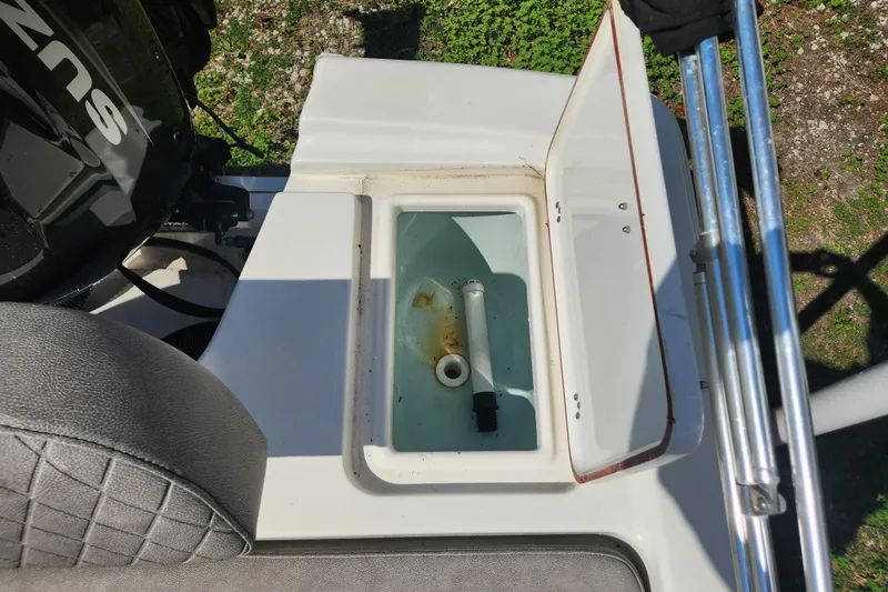 Slide: The Image of 2021 Sea Pro 172 Bay boat with open storage compartment and visible engine. - 11