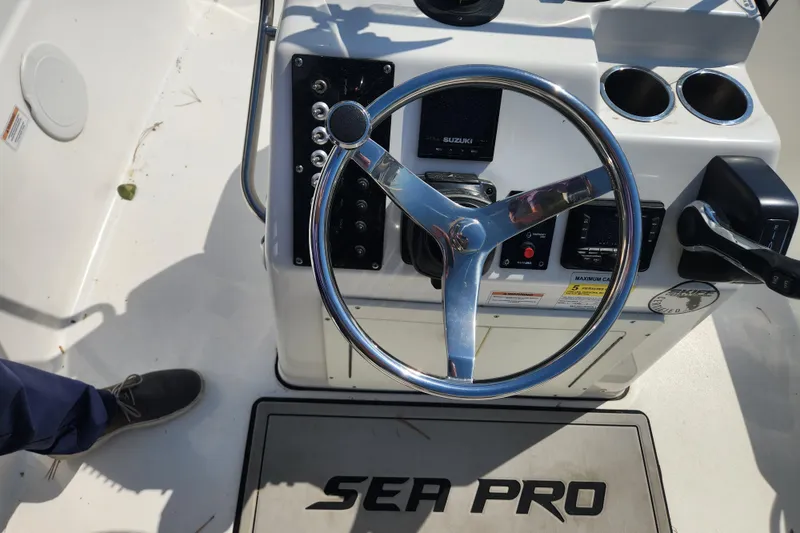 Slide: The Image of 2021 Sea Pro 172 Bay boat console with steering wheel and controls. - 14
