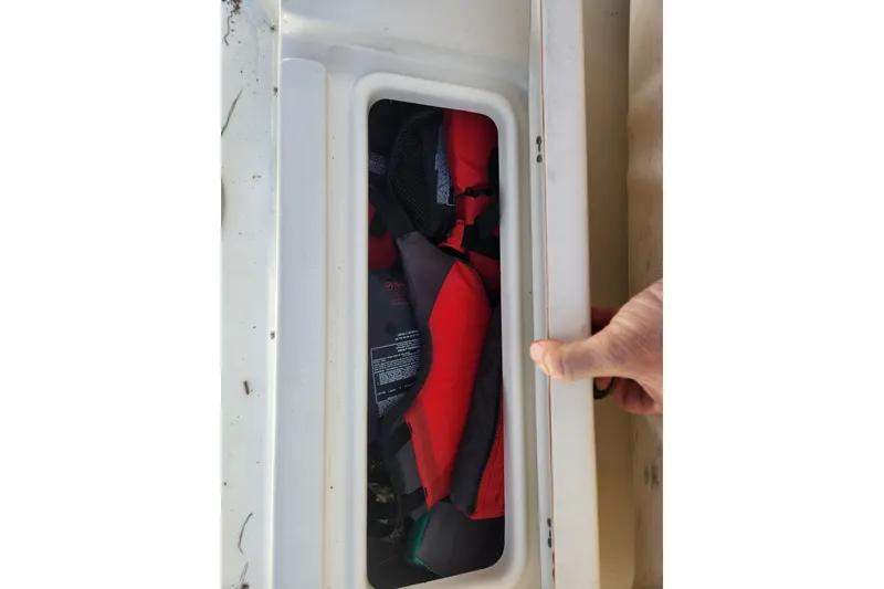 Slide: The Image of Storage compartment on 2021 Sea Pro 172 Bay boat with life jackets inside. - 18