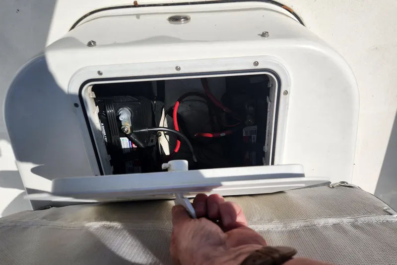Slide: The Image of Opening battery compartment on 2021 Sea Pro 172 Bay boat, showing wiring and connections. - 20