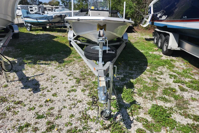 Slide: The Image of 2021 Sea Pro 172 Bay boat on trailer, parked outdoors on gravel. - 23