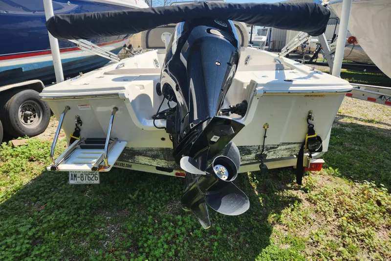 Slide: The Image of 2021 Sea Pro 172 Bay boat rear view with outboard motor and ladder. - 4