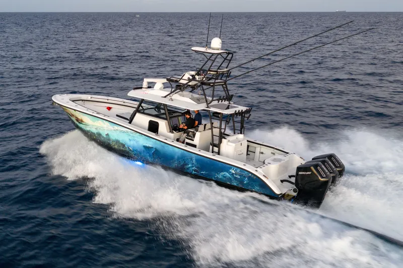 Slide: The Image of 2023 Yellowfin 42 Offshore boat cruising on open ocean waters. - 11
