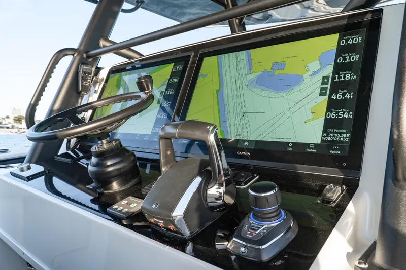 Slide: The Image of Dashboard of 2023 Yellowfin 42 Offshore boat with navigation screens and controls. - 21