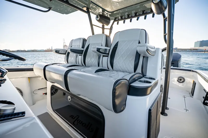 Slide: The Image of 2023 Yellowfin 42 Offshore boat interior with luxury seating and ocean view. - 22
