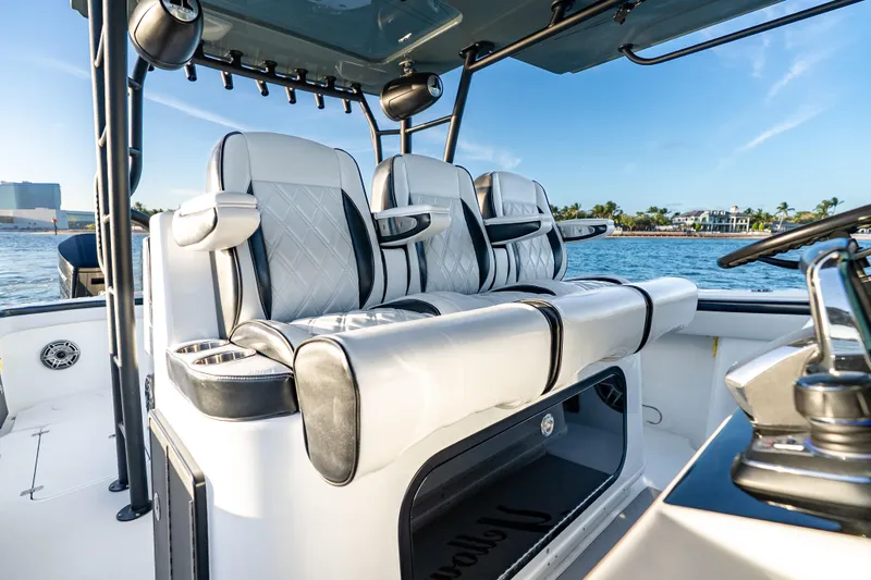 Slide: The Image of Luxurious seating on 2023 Yellowfin 42 Offshore boat, featuring sleek design and ocean backdrop. - 23