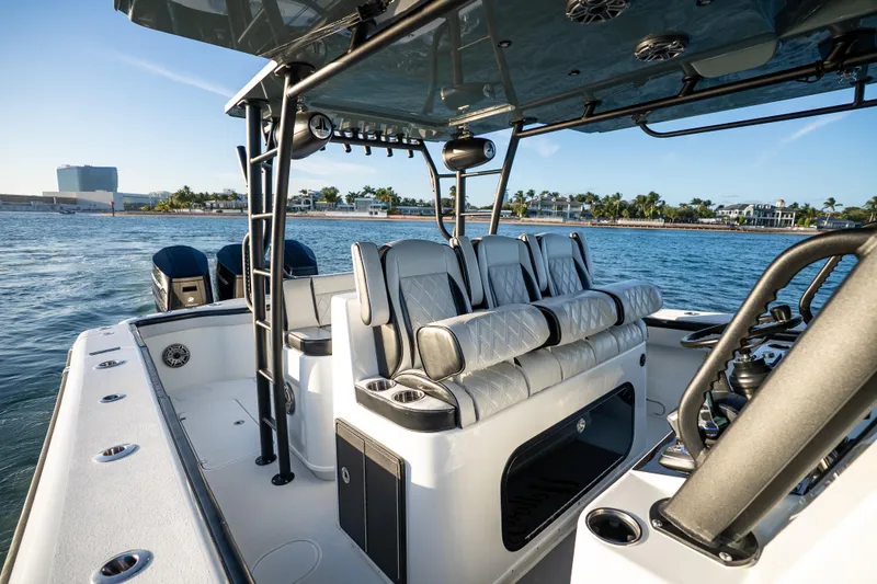 Slide: The Image of 2023 Yellowfin 42 Offshore boat interior with luxurious seating on the water. - 24
