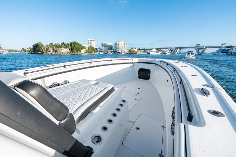 Slide: The Image of 2023 Yellowfin 42 Offshore boat on water, featuring spacious deck and luxurious seating. - 30