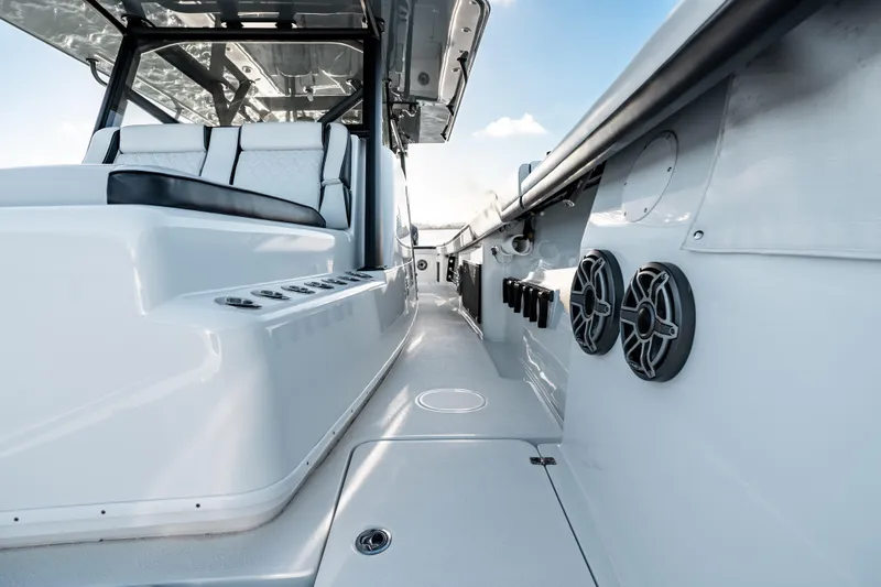 Slide: The Image of 2023 Yellowfin 42 Offshore boat interior with seating and speakers. - 32