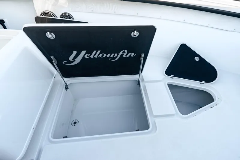 Slide: The Image of 2023 Yellowfin 42 Offshore boat storage compartments with open hatches. - 33