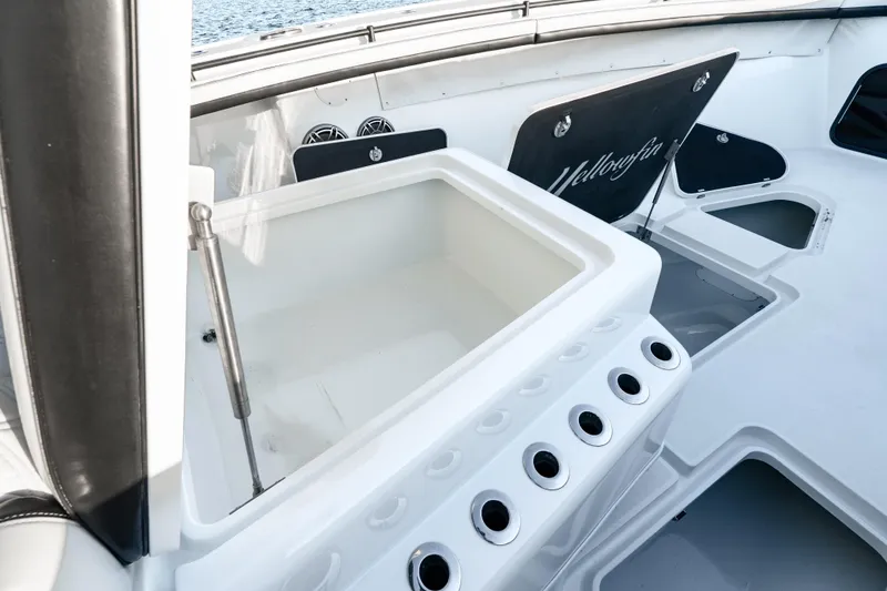 Slide: The Image of 2023 Yellowfin 42 Offshore boat interior with storage compartments and rod holders. - 34