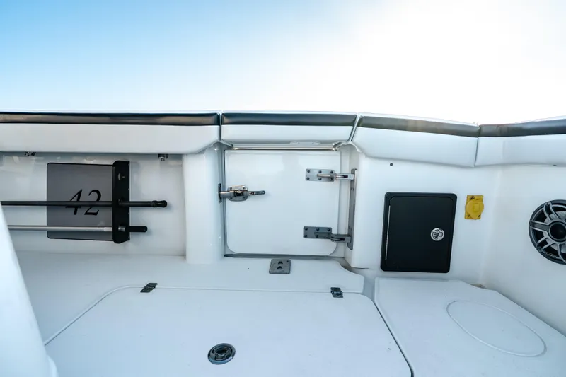 Slide: The Image of 2023 Yellowfin 42 Offshore boat interior with storage compartments and speaker. - 41