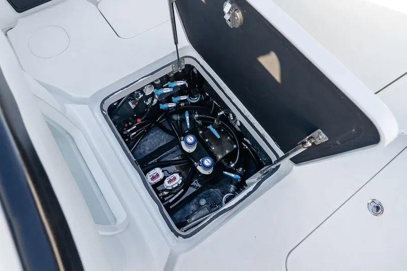 Slide: The Image of 2023 Yellowfin 42 Offshore boat compartment with visible wiring and components. - 43