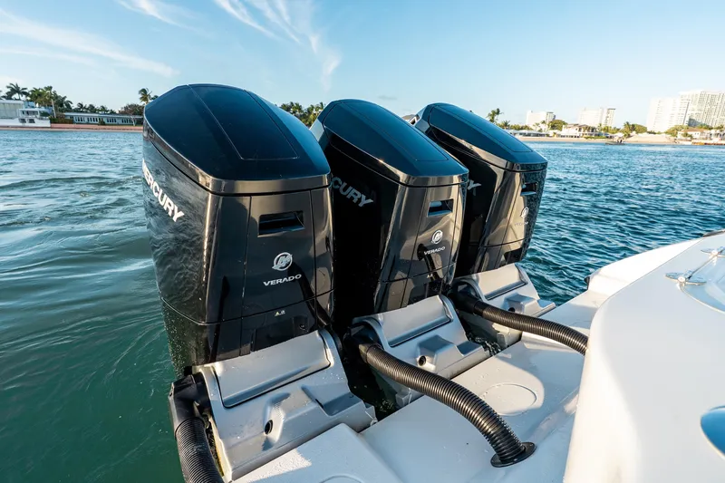 Slide: The Image of Triple Mercury Verado engines on 2023 Yellowfin 42 Offshore boat in coastal waters. - 46