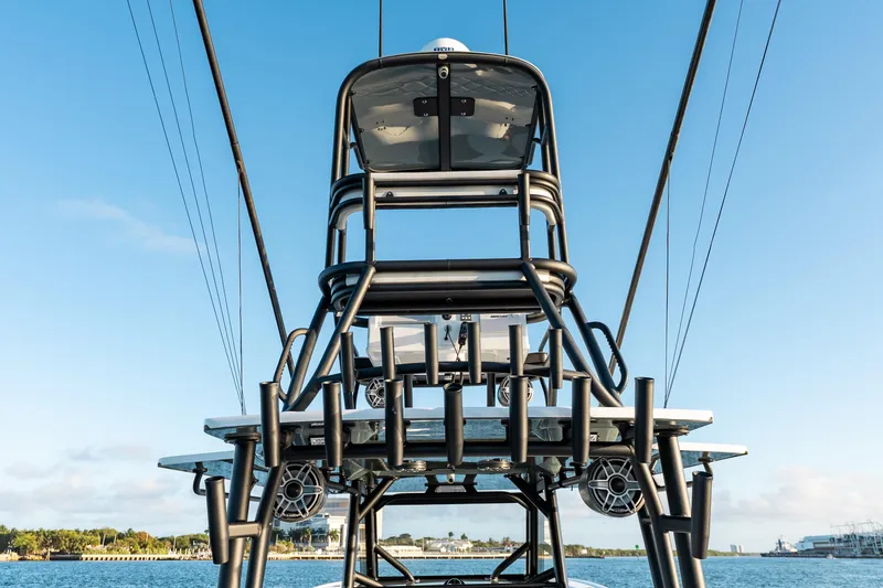 Slide: The Image of 2023 Yellowfin 42 Offshore boat tower against clear blue sky. - 47
