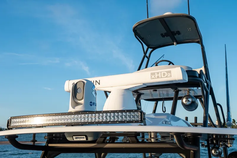 Slide: The Image of 2023 Yellowfin 42 Offshore boat with advanced radar and navigation equipment. - 52