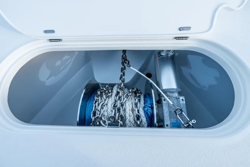 Slide: The Image of Anchor chain compartment of 2023 Yellowfin 42 Offshore boat, featuring secure storage. - 59