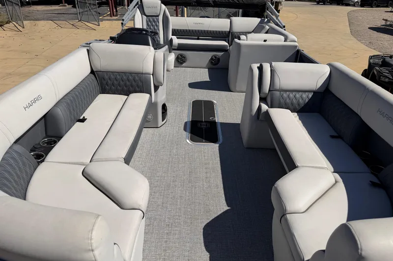 Slide: The Image of 2025 Harris Sunliner 230 pontoon boat interior with luxurious seating and modern design. - 7