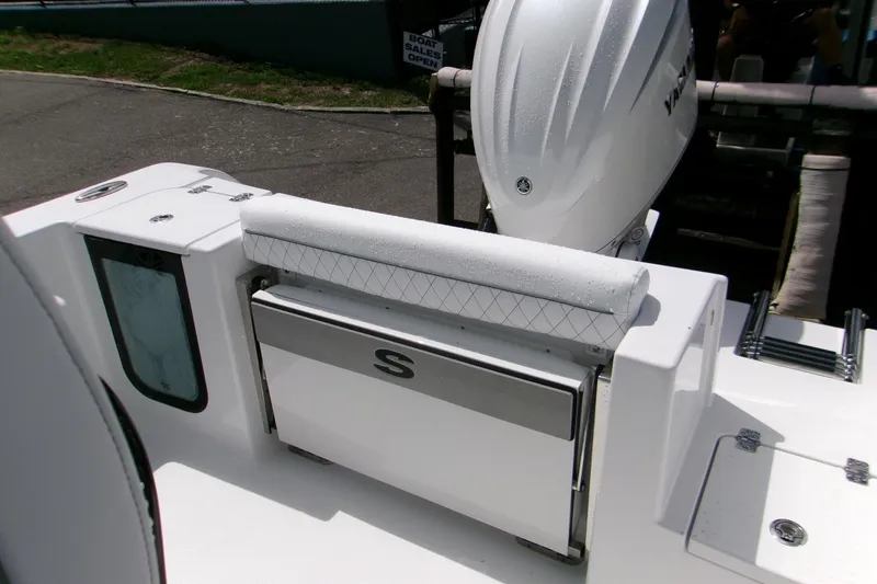 Slide: The Image of 2026 Sportsman Open 232 Center Console boat with Yamaha engine, rear seating, and storage. - 10