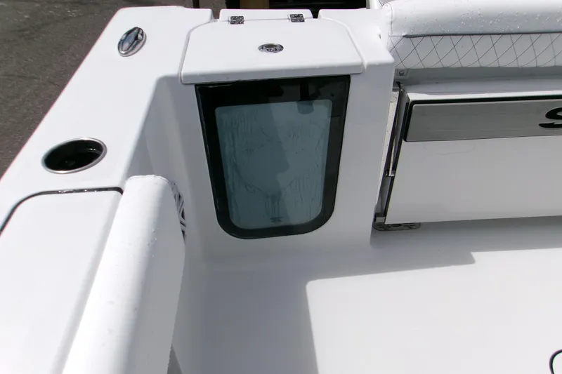 Slide: The Image of 2026 Sportsman Open 232 Center Console boat interior detail, featuring sleek white design. - 17