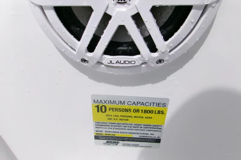 Slide: The Image of 2026 Sportsman Open 232 Center Console speaker and capacity label, 10-person limit. - 18