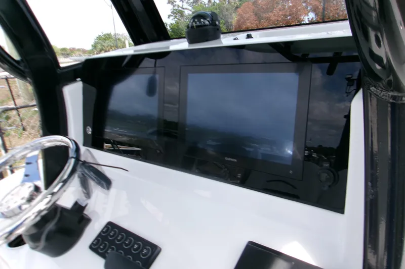 Slide: The Image of 2026 Sportsman Open 232 Center Console dashboard with modern navigation displays. - 19