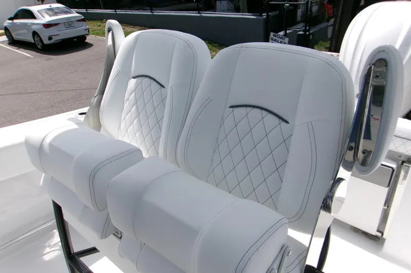 Slide: The Image of 2026 Sportsman Open 232 Center Console boat seats with diamond stitching detail. - 9