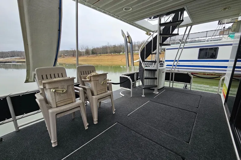 Slide: The Image of Houseboat deck with chairs, spiral staircase, and lake view; Lakeview 16x60, 2002 model. - 10