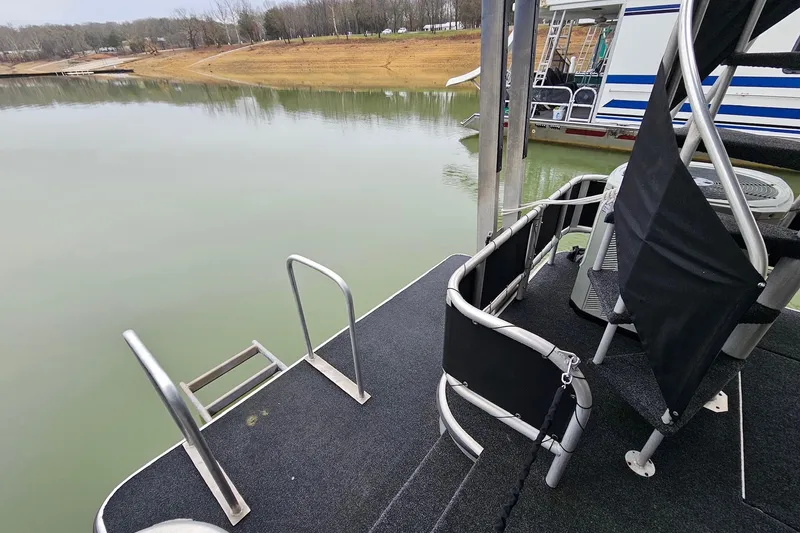 Slide: The Image of Rear deck of a 2002 Lakeview 16x60 houseboat with water view. - 12