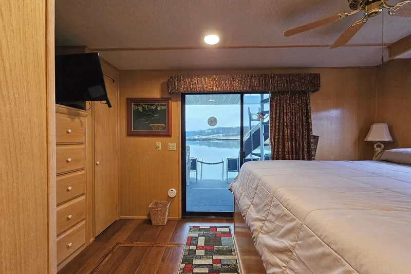 Slide: The Image of Cozy bedroom in 2002 Lakeview 16x60 houseboat with lake view and modern amenities. - 38