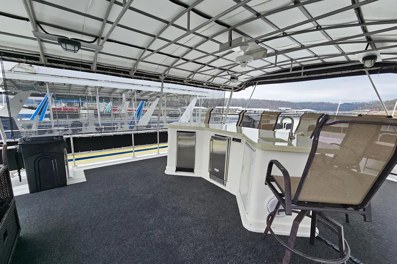 Slide: The Image of Spacious deck of 2002 Lakeview 16x60 houseboat with bar and seating area. - 52