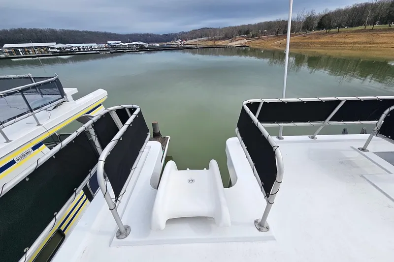 Slide: The Image of Houseboat with slide on calm lake, Lakeview 16x60 model, 2002. - 59