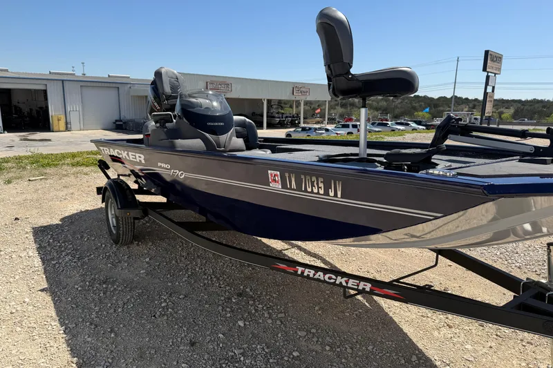 Slide: The Image of 2021 Tracker Pro 170 boat on trailer, parked outdoors near dealership. - 4