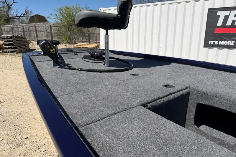 Slide: The Image of 2021 Tracker Pro 170 boat deck with seat and control panel, outdoor setting. - 7