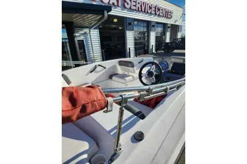Slide: The Image of 2021 Tahoe T16 boat interior at service center, featuring steering wheel and dashboard. - 3